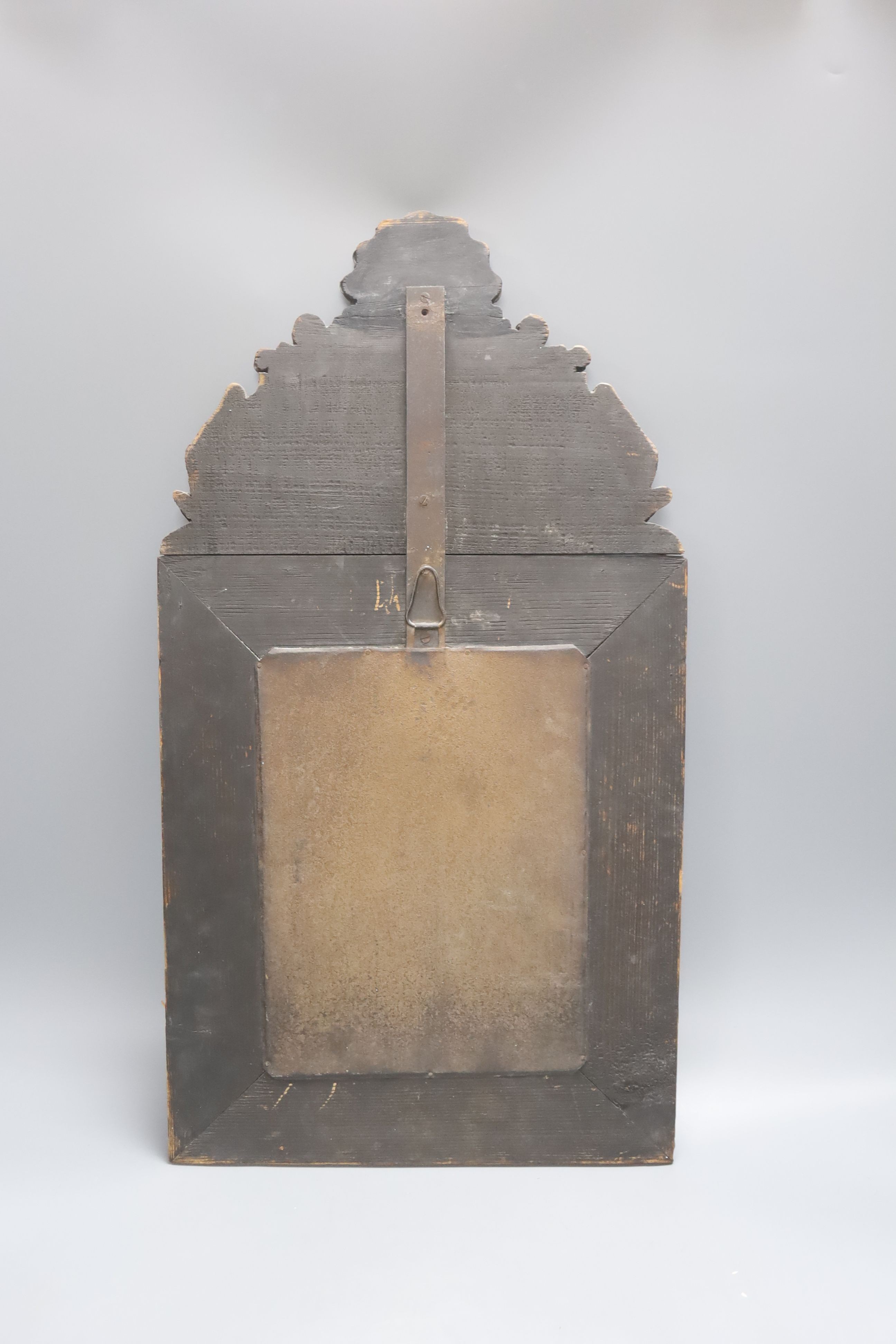 A 19th century Dutch embossed copper mounted wall mirror 58cm
